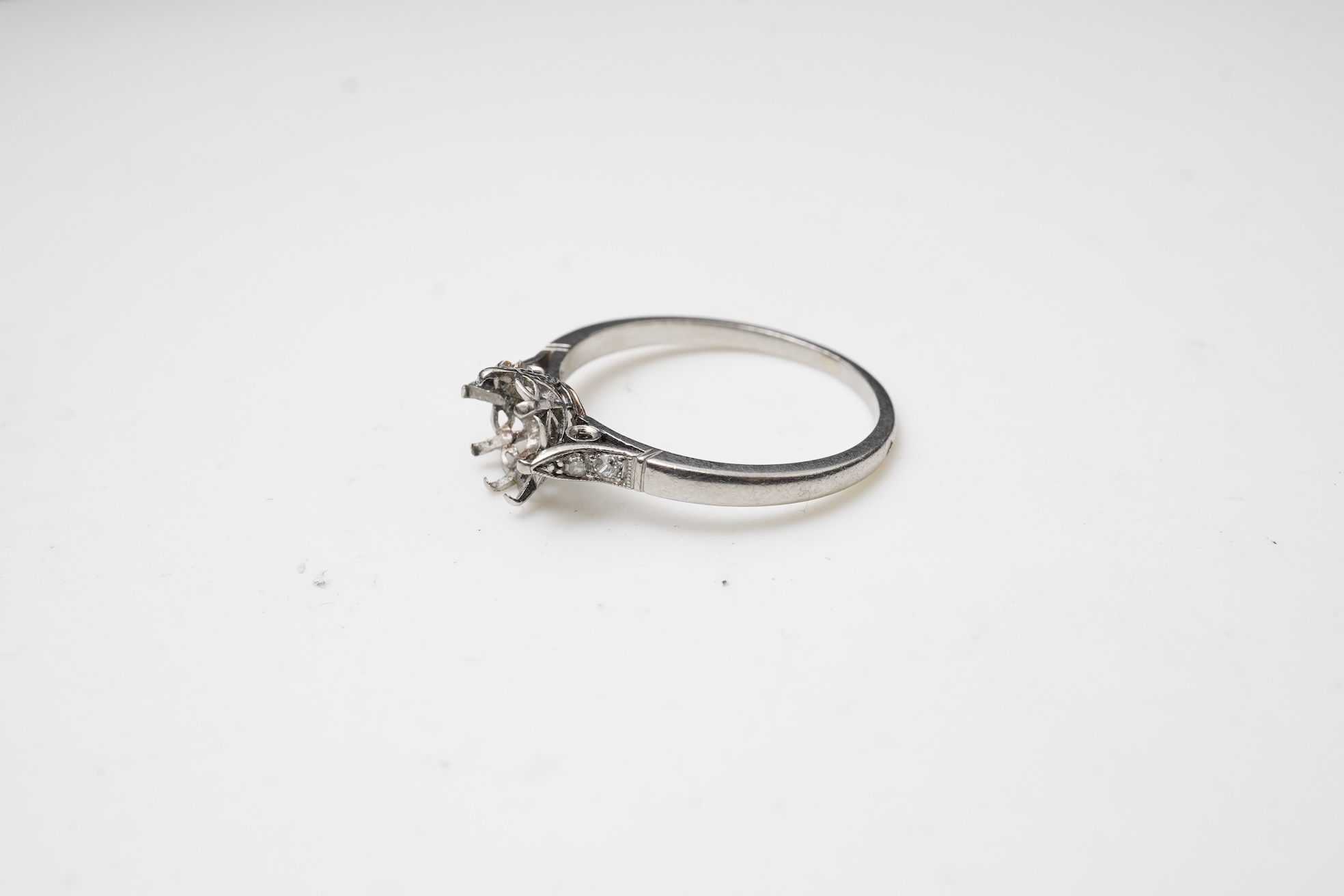 A platinum and diamond ring mount, France, early 20th century